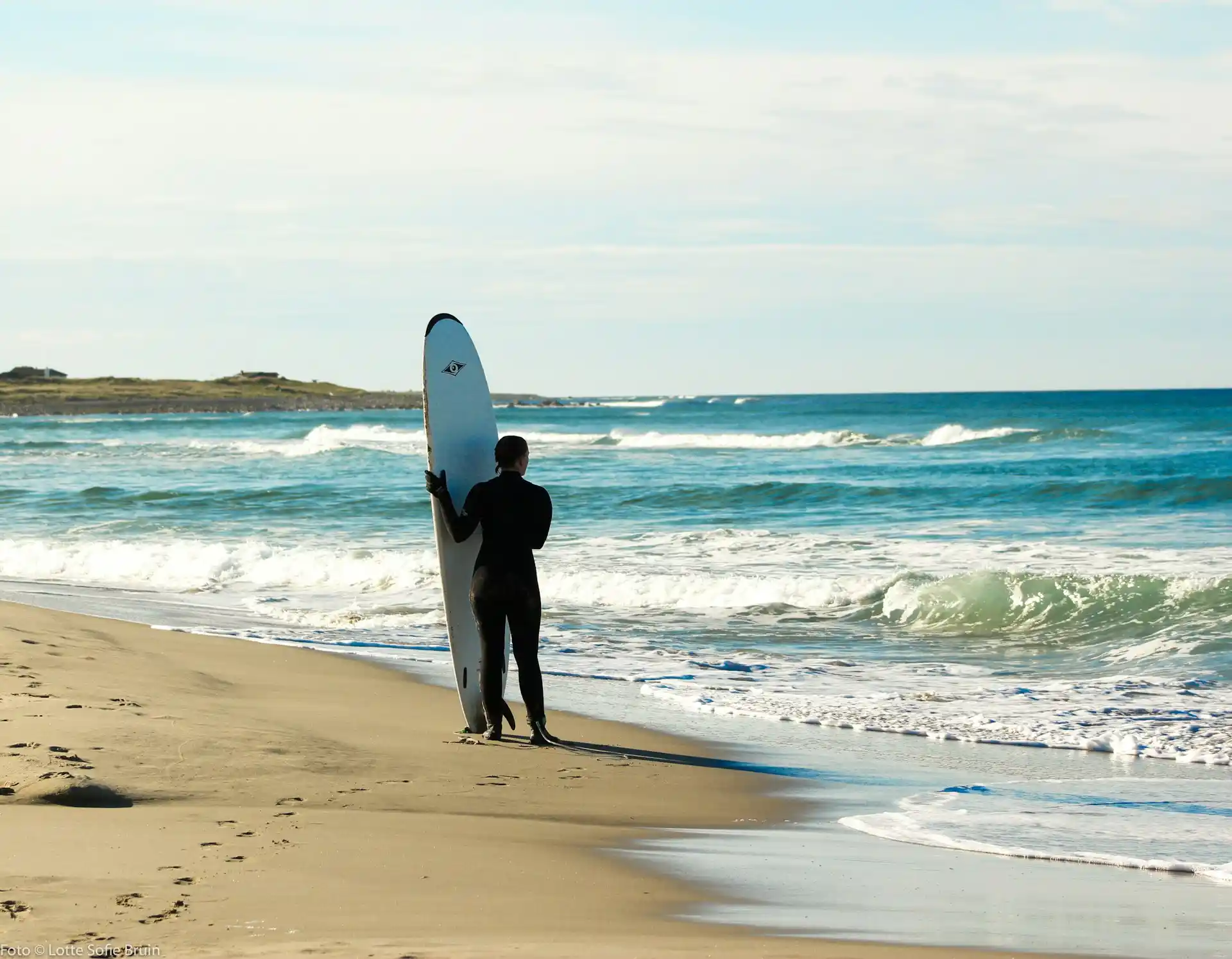 Surfer a clean ocean wave during Bali's surf season